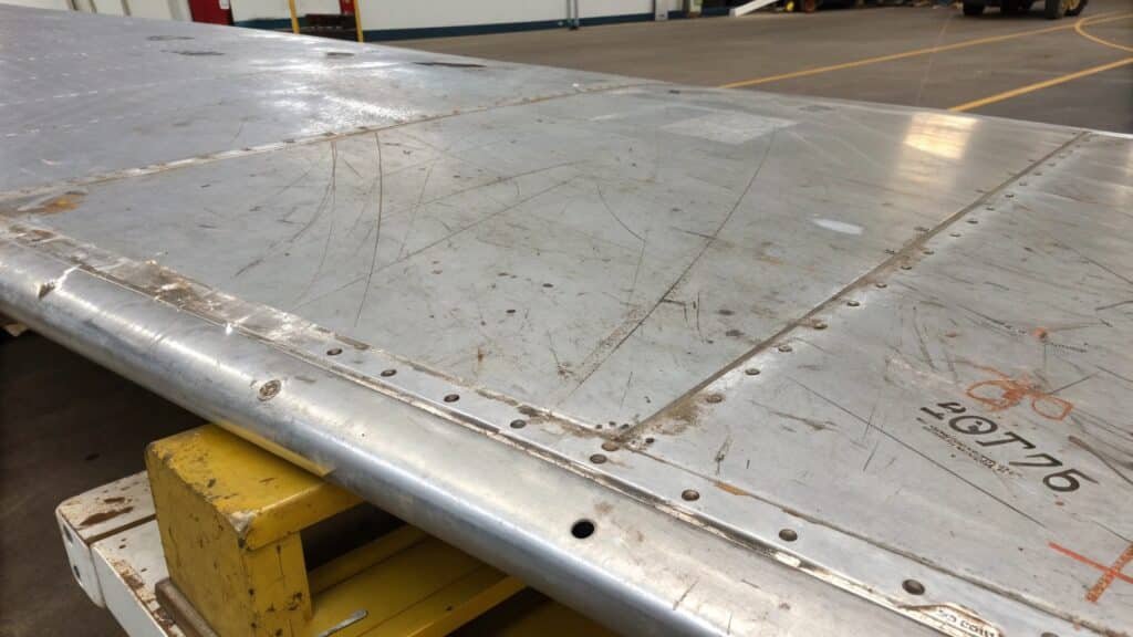 An image showing a cracked weld bead on a piece of 7075 aluminum, illustrating its poor weldability.